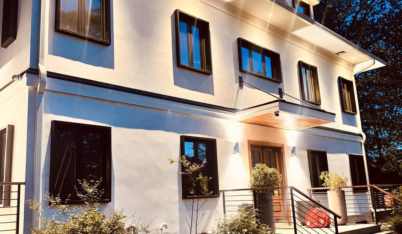A new build at dusk, lamps lit — Scarsdale